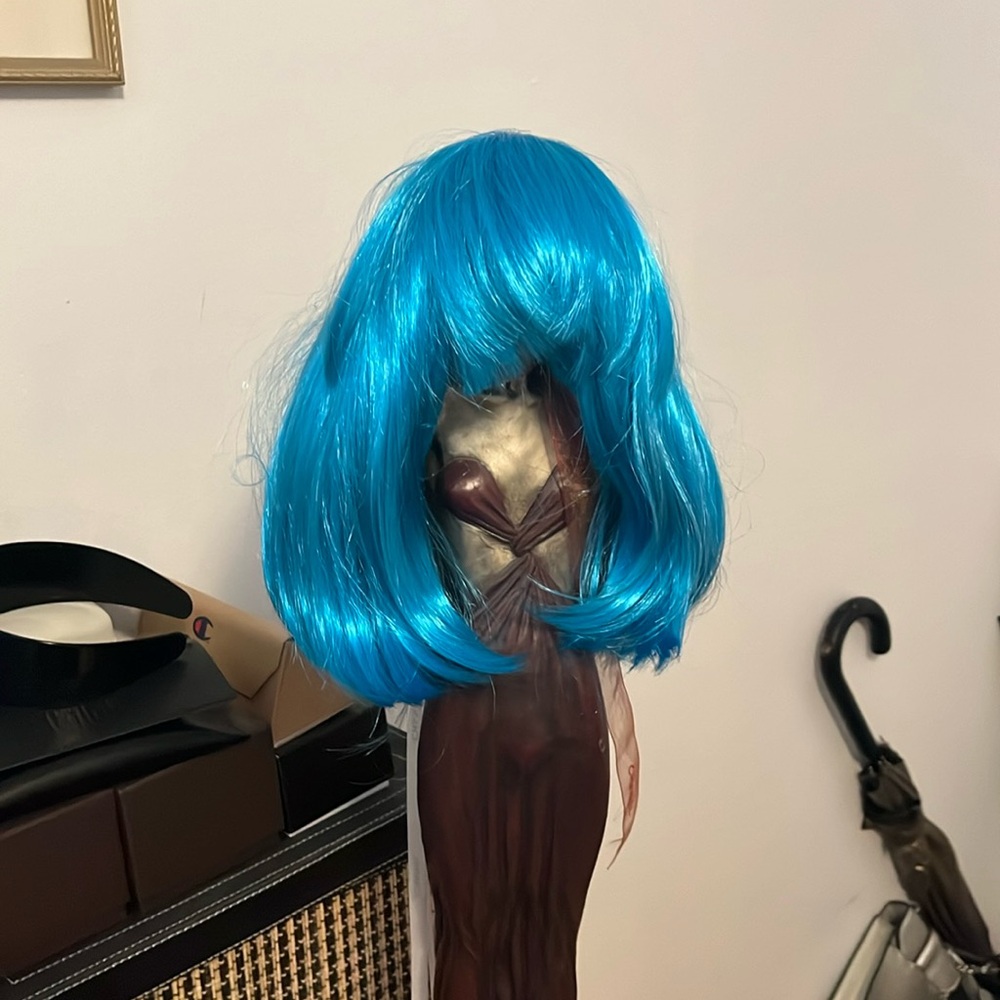 Halloween costume with wig.